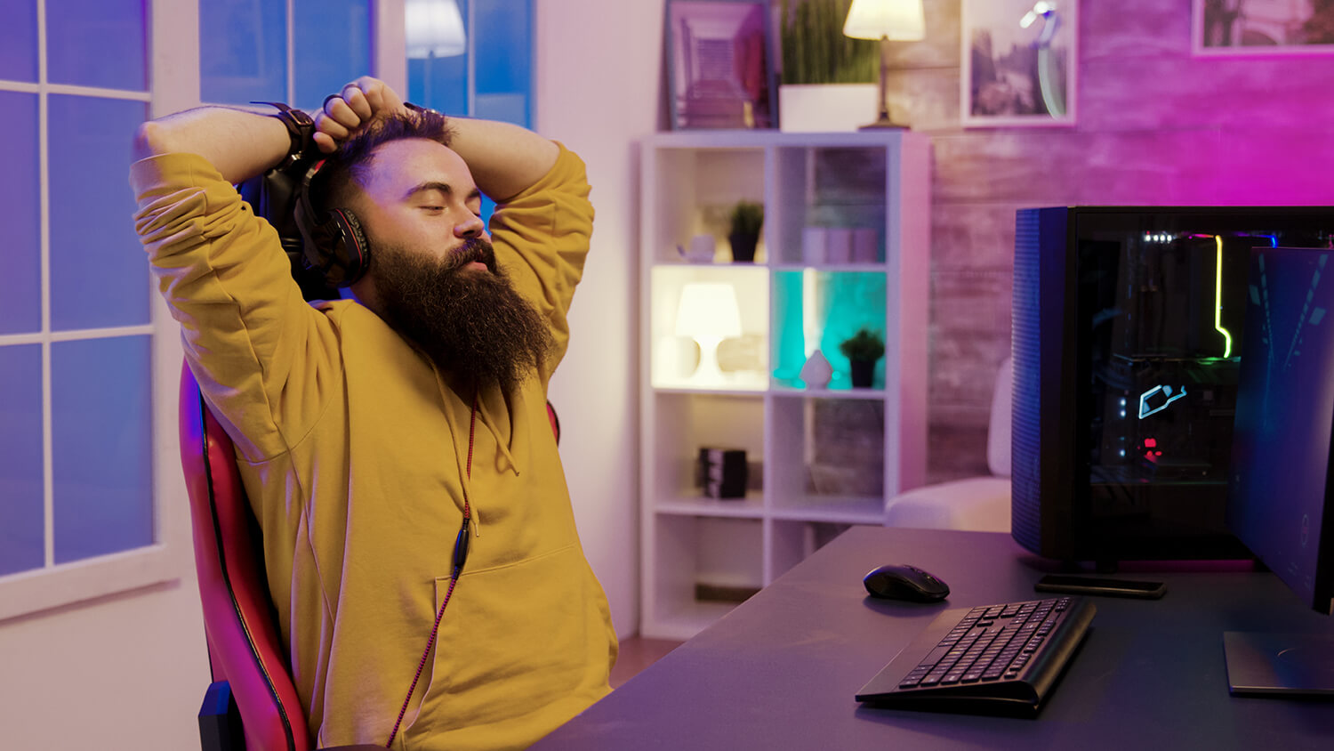 happy bearded man after wining online gaming man wearing headphones while playing video games1 | چیپکد